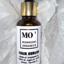 A jar of hair serum.contains oils esssential for hair growth